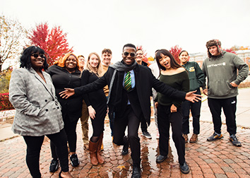 A group of students pose outside for a picture.