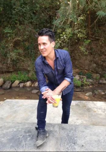 David Zach, posing with a drink