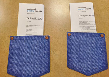 Two pockets with folded paper printed with text placed side-by-side on a surface.