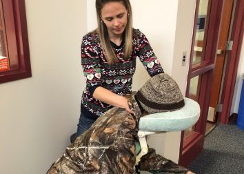 A person getting a professional chair massage.