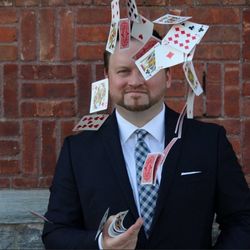 Michael Misko flinging a deck of cards
