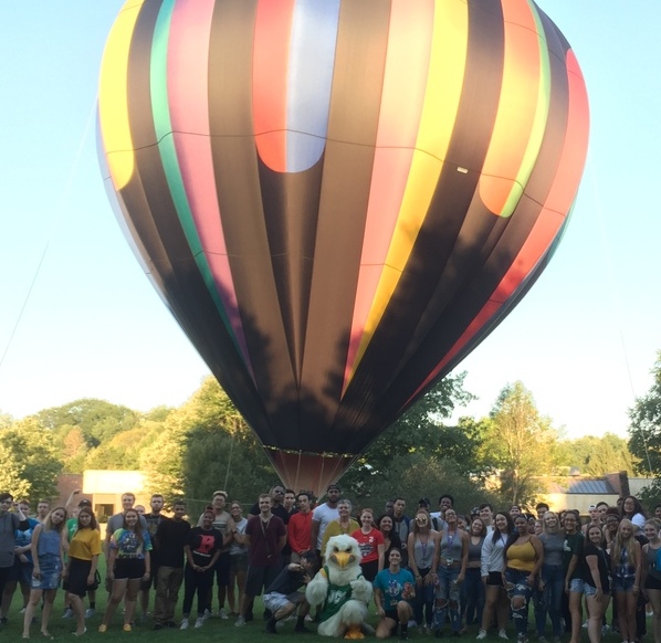 A hot air balloon suspended in air over the SUNY JCC Campus