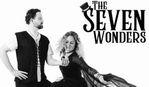 A man holding the hand of a dancing woman with the words "The Seven Wonders."