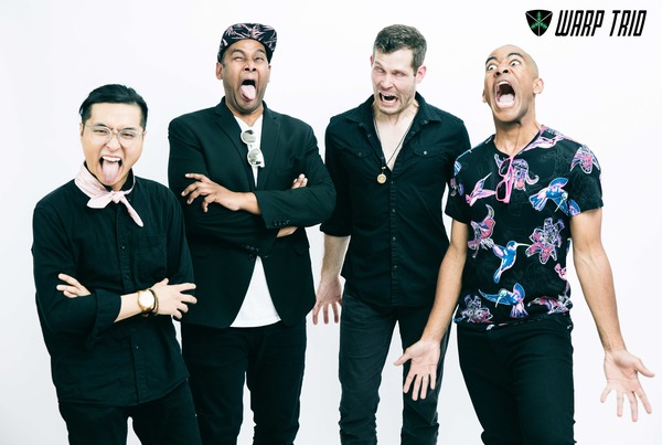 Members of Warp Trio making faces in a promotional photo.