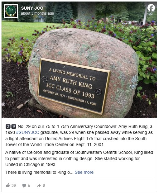 A memorial plaque mounted on a stone reads "A Living Memorial to Amy Ruth King, JCC Class of 1993," with dates. Surrounded by plants, symbolizing remembrance.