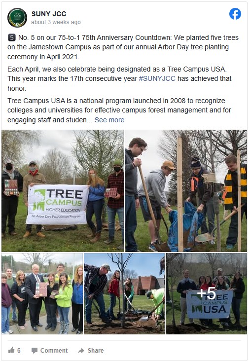 Group of people at Jamestown Campus, participating in a tree planting ceremony. They hold a "Tree Campus USA" banner and plant a tree together.