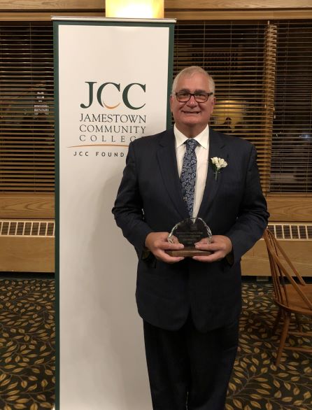 John Whelpley holding a JCC Foundation award