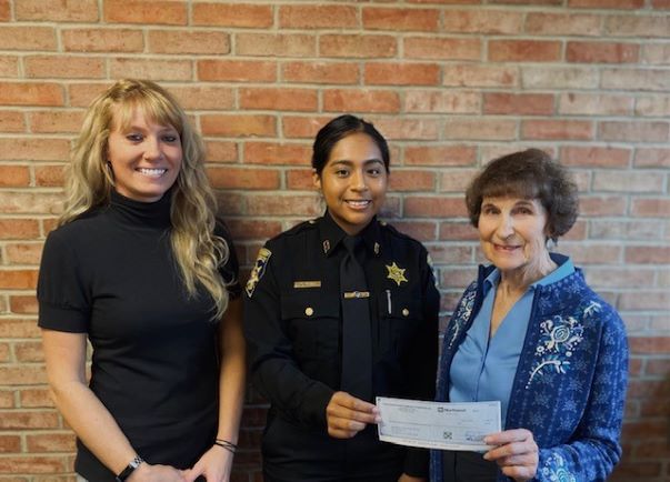 Chautauqua County Sheriff’s Academy recruit Yvette Perez was awarded the Dan Feather Memorial Scholarship. Perez is pictured with Sgt. Raechel Waid, Sheriff’s Academy director, left, and Verna Feather, widow of Dan Feather.