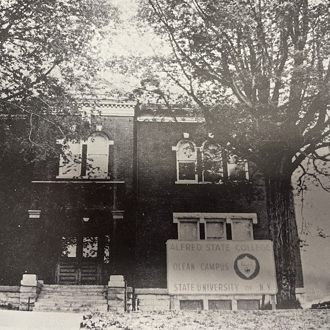 A black and white photo shows the brick building of Alfred State College Olean Campus, State University of New York, with large trees framing the facade.