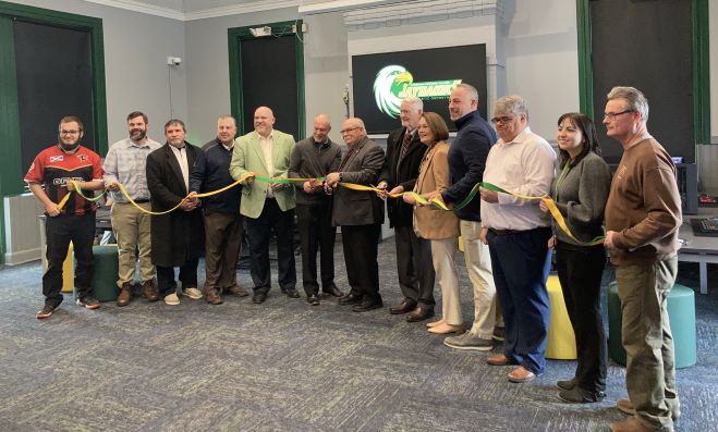 Local leaders and JCC administration and staff cut the ribbon to open JCC's new eSports stadium.