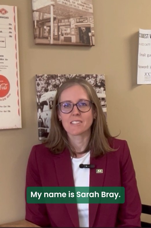 Screenshot of a video of a person talking with the words "My name is Sarah Bray."