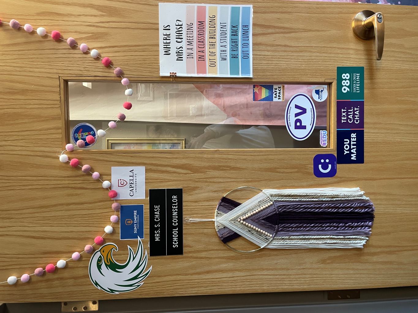 A decorated exterior door of a high school guidance counselor.