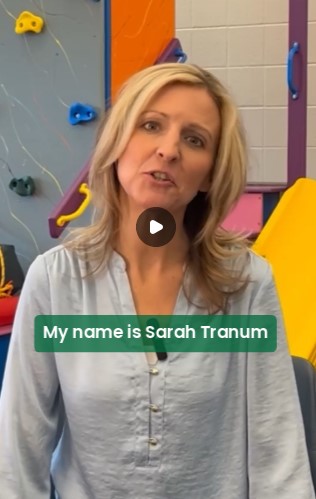 Screenshot of a video of a person talking with the words My name is Sarah Tranum.