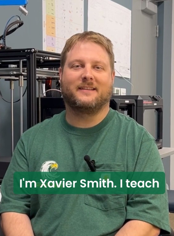 Screenshot of a video of a person talking with the words I'm Xavier Smith. 