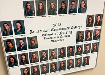 A group image of the 2023 School of Nursing graduates at SUNY Jamestown Community College hangs on the wall of the department on the Jamestown Campus