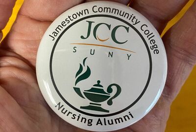 A magnetic held in hand that reads Jamestown Community College Nursing Alumni and shows the SUNY JCC logo.
