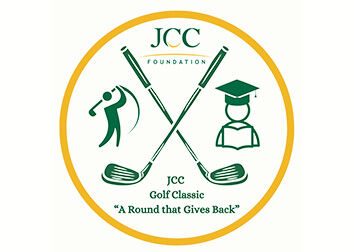 A circular emblem with an icon of a golfer, crossed golf clubs, and a graduate at the center with the words "JCC Foundation JCC Golf Classic 'A round that gives back.'"