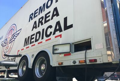 A large semi truck trailer with the words Remote Area Medical.