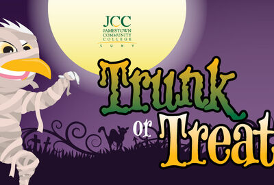 A graphic showing a cartoon JCC Jayhawk mascot dressed up like a mummy for Halloween with the JCC logo and the words Trunk or Treat.