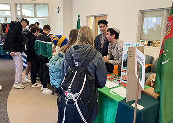 College students from Turkmenistan share information about their country at a Go Global Fair at SUNY Jamestown Community College.