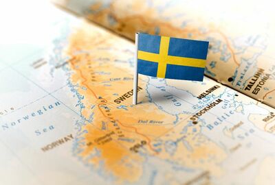 The Sweden flag is pinned on a European map, showcasing Sweden's place in the broader context of Europe.
