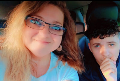 Mother and son together in a car.
