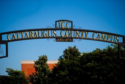A wrought iron sign that reads JCC Cattaraugus County Campus.