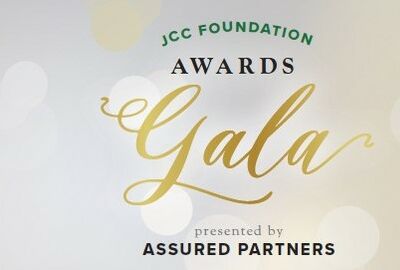 Elegant JCC Foundation Awards Gala invitation with gold script and a soft bokeh background. Text notes it's presented by Assured Partners.
