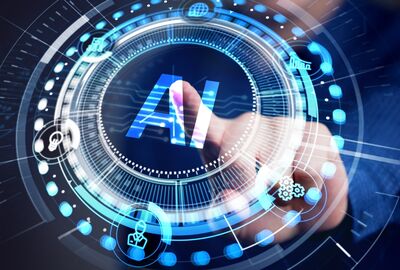 A hand is touching a glowing blue circular interface with the letters "AI" prominently displayed in the center, surrounded by technological icons and circuitry.